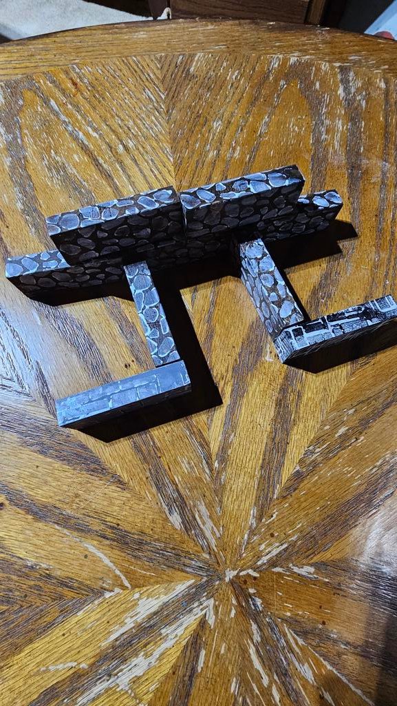 Early homemade gaming setup using painted Jenga blocks to create dungeon rooms and terrain on a wooden table. A simple, creative DIY battlefield from Nathan’s early days of solo RPGs.