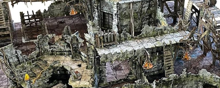 Battle Systems Fantasy Dungeon terrain set fully assembled on a gridded table, showing detailed ruins, bridges, stairs, and modular dungeon pieces with the original product box in the background.