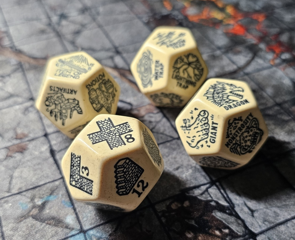 Four large chunky bone-colored random generator dice resting on a dark gaming mat. Each die shows fantasy-themed symbols including Dragon, Giant, Monstrosity, and dungeon features in vintage parchment style.